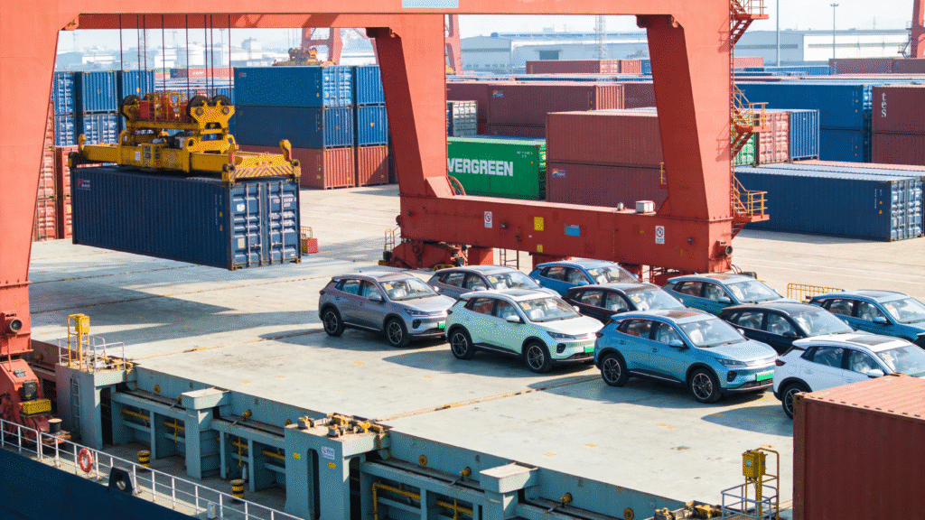 Chinese electric vehicles being prepared for export at a container port